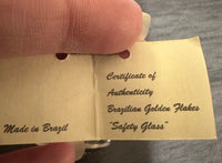 Gold Flakes in Glass Bottle