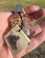 Gold Flakes in Glass Bottle