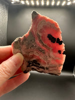 Natural Rhodochrosite Slab #17 – Pink Banded Mineral Specimen with Black Matrix