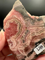 Natural Rhodochrosite Slab #17 – Pink Banded Mineral Specimen with Black Matrix