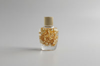 Gold Flakes in Glass Bottle