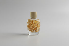 Gold Flakes in Glass Bottle