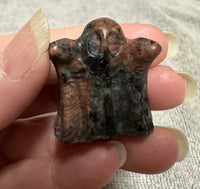 Carved Red Amphibole Ghost