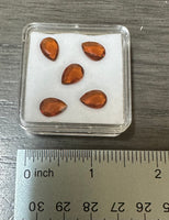 Parcel of Five Amber Colored Pearshape Stones