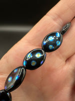 Czech Glass Peacock Eye Oval Bead Strand – Black & Iridescent Blue –
