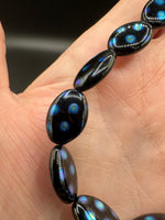 Czech Glass Peacock Eye Oval Bead Strand – Black & Iridescent Blue –