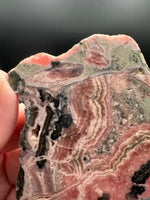 Natural Rhodochrosite Slab #17 – Pink Banded Mineral Specimen with Black Matrix
