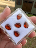 Parcel of Five Amber Colored Pearshape Stones