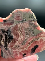 Natural Rhodochrosite Slab #17 – Pink Banded Mineral Specimen with Black Matrix