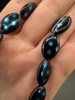 Czech Glass Peacock Eye Oval Bead Strand – Black & Iridescent Blue –