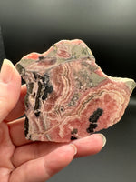 Natural Rhodochrosite Slab #17 – Pink Banded Mineral Specimen with Black Matrix