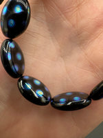 Czech Glass Peacock Eye Oval Bead Strand – Black & Iridescent Blue –