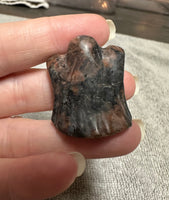 Carved Red Amphibole Ghost