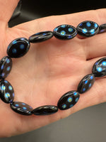 Czech Glass Peacock Eye Oval Bead Strand – Black & Iridescent Blue –