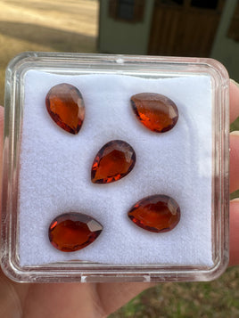 Parcel of Five Amber Colored Pearshape Stones
