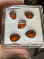 Parcel of Five Amber Colored Pearshape Stones
