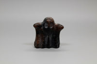 Carved Red Amphibole Ghost