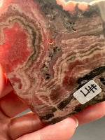 Natural Rhodochrosite Slab #17 – Pink Banded Mineral Specimen with Black Matrix
