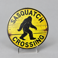 Sasquatch Crossing Round Metal Tin Sign – Distressed Bigfoot Wall Decor
