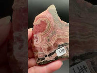 Natural Rhodochrosite Slab #17 – Pink Banded Mineral Specimen with Black Matrix