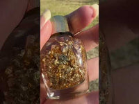 Gold Flakes in Glass Bottle